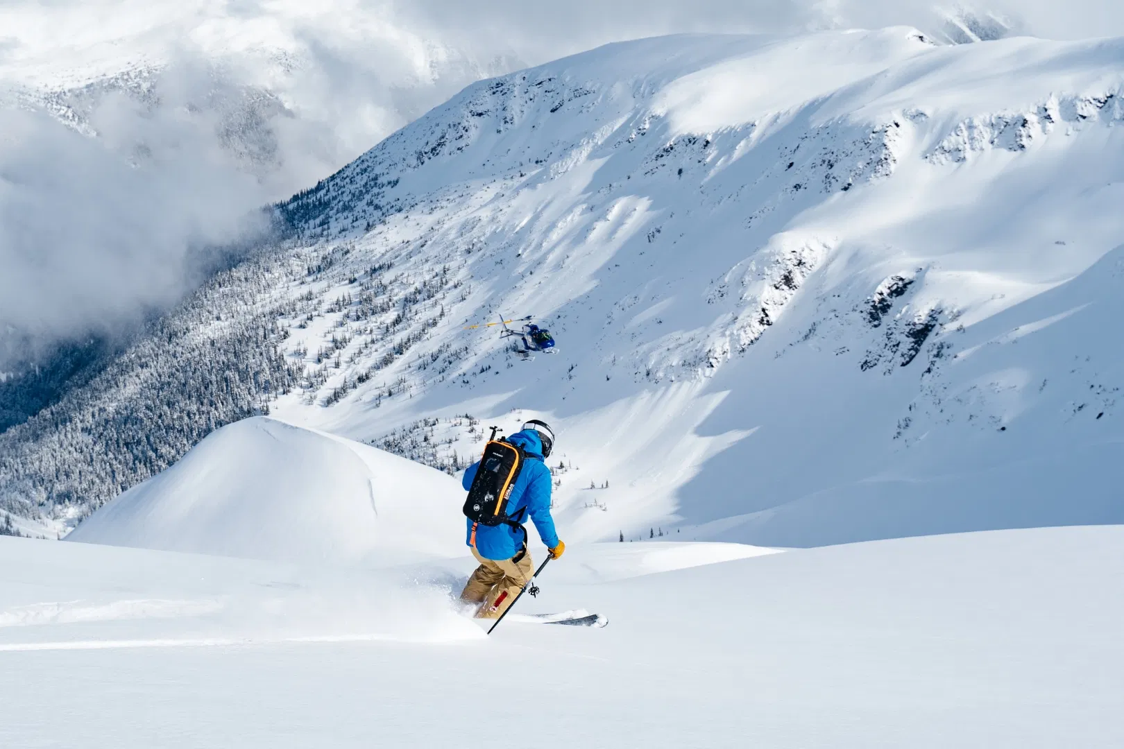 Freerider in open terrain with a view of the mountain panorama