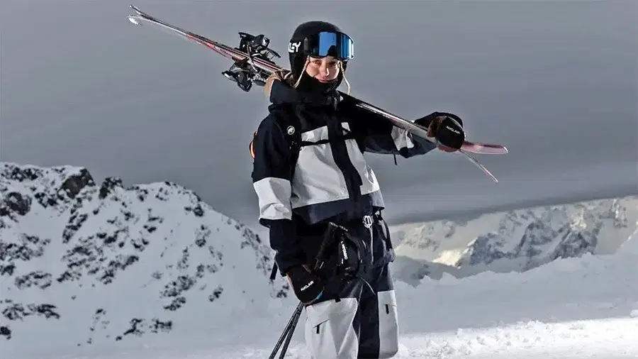 A guest in PeakPerformance outerwear on a ridge above the White Wilderness tenure.